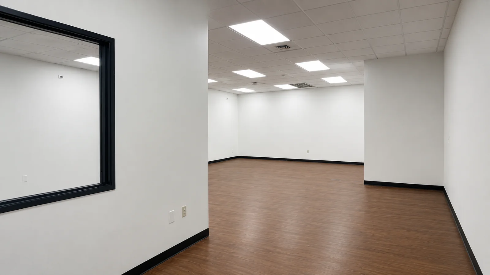 Open work area in Suite 101B looking into the adjoining room