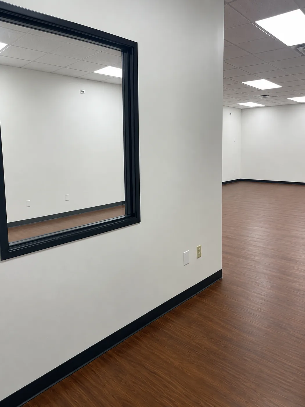 Open work area in Suite 101B looking into the adjoining room